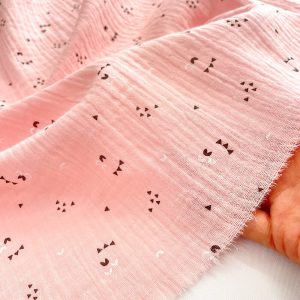 Mussola in cotone rosa Certificata GOTS con stampa occhietti