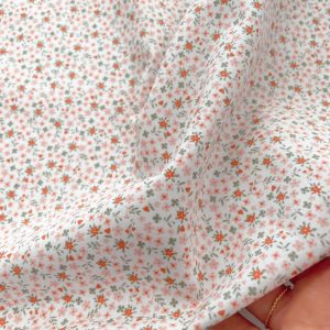 Cotone morbidissimo con Certificazione Oeko-Tex con stampa fiorellini cipria
