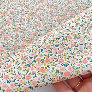 Cotone morbidissimo con Certificazione Oeko-Tex con stampa fiorellini pesca