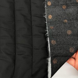 IMPERMEABILIZZATO TRAPUNTATO NERO E SPINATO