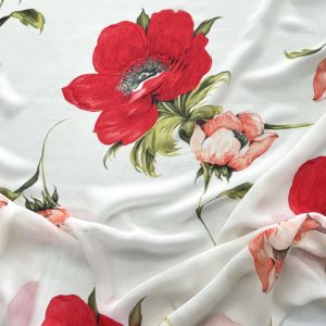 Georgette di viscosa con stampa anemoni rossi e color pesca su base bianca